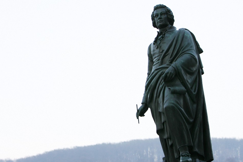 Picture of the statue of Wolfgang Amadeus Mozart emerging from the skyline in Salzburg. Agence France-Presse file photo