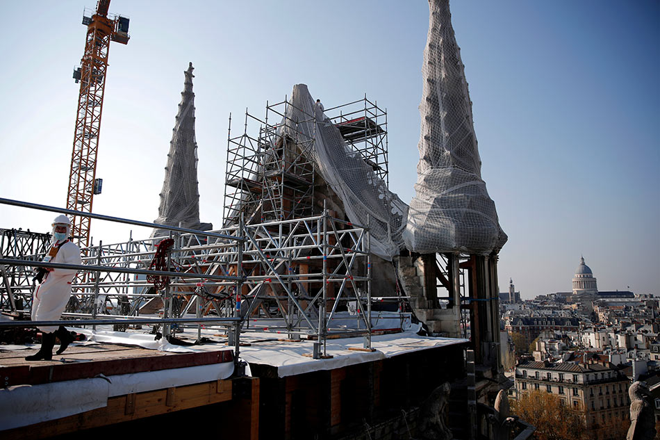 A view shows the reconstruction site of the roof of the Notre-Dame de Paris Cathedral, which was damaged in a devastating fire in 2019, as restoration works continue, in Paris on April 15, 2021. Benoit Tessier pool, Reuters/file