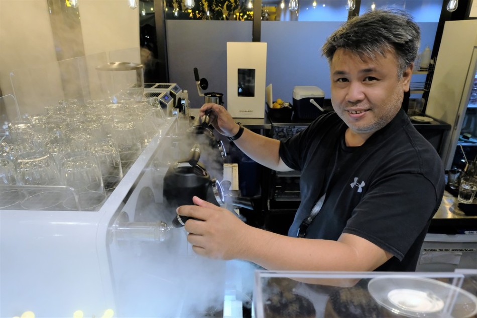Rich Watanabe behind the San Remo Opera espresso machine. Jeeves de Veyra