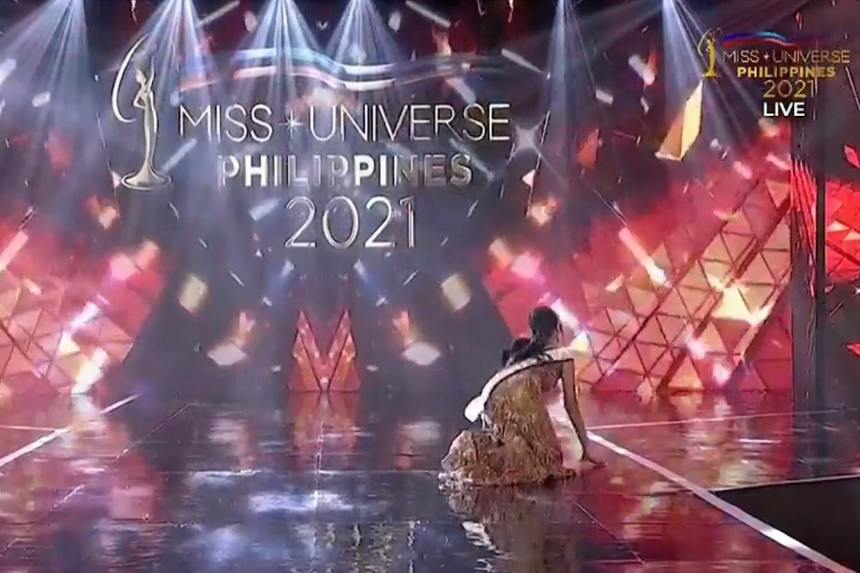 Miss Universe Philippines 2020 Rabiya Mateo trips and falls to her knees during her final walk at the 2021 coronation night on Thursday. Screenshot