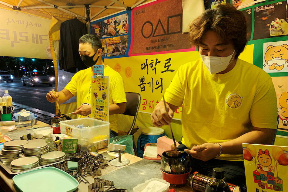 An Yong-hui, Dalgona shop owner, makes a dalgona candy in Seoul, South Korea. Minwoo Park, Reuters
