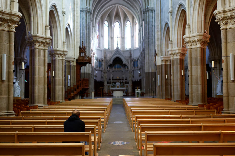 A man prays inside the Saint-Martin co Reuters
