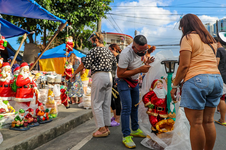 People flock to the Daptian Arcade in Quezon City to purchase Christmas decorations on October 19, 2021 days after the capital region was put under the looser quarantine Alert Level 3 which allows for the opening of more business establishments. Jonathan Cellona, ABS-CBN News