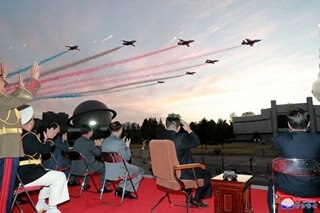Kim Jong Un watches demo flight at NoKor expo