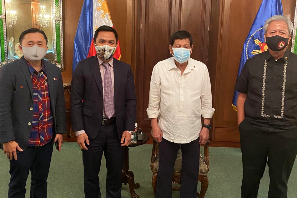 Presidential aspirant Sen. Manny Pacquiao (2nd from left) and President Rodrigo Duterte (2nd from right) after a meeting last month. Handout of Office of Sen. Manny Pacquiao
