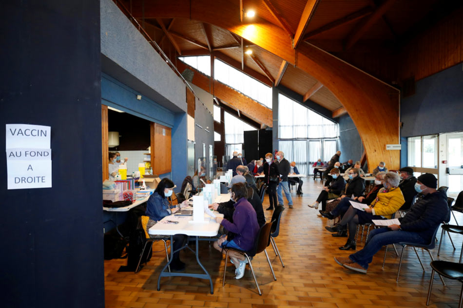 A view shows people registering via Stephane Mahe, Reuters
