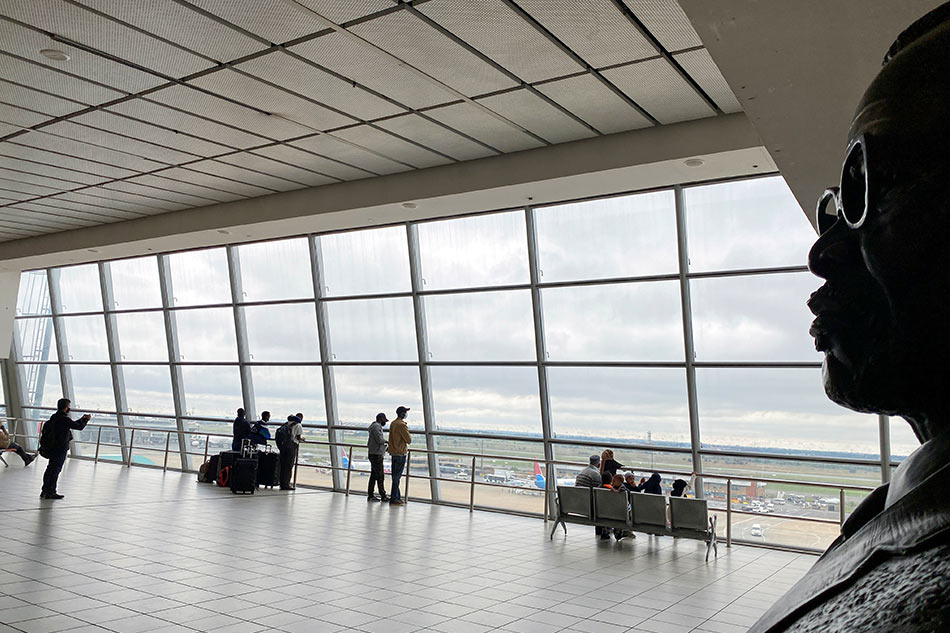Passengers wait to board flights Reuters