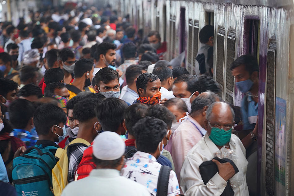 Commuters disembark from a suburban train via Reuters
