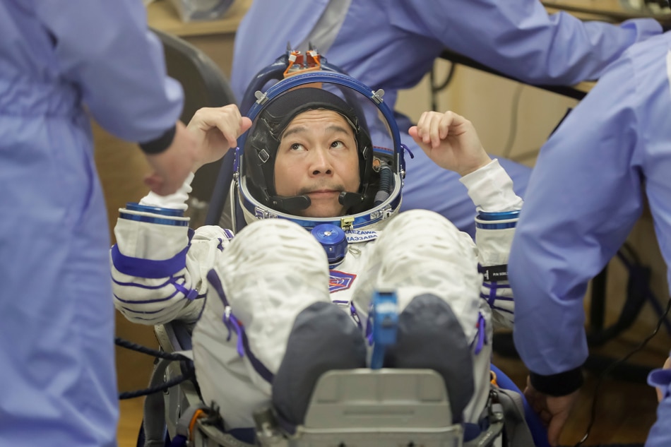  Japanese entrepreneur Yusaku Maezawa looks on during space suits check shortly before the launch to the International Space Station (ISS) at the Baikonur Cosmodrome, Kazakhstan, December 8, 2021. Shamil Zhumatov, Reuters