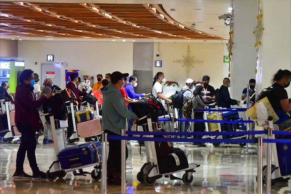 Passengers arrive at the NAIA Terminal 1 on November 29, 2021 amid the IATF ban on 14 countries affected by the Omicron variant of the coronavirus. Passengers coming from or have been to the countries under the list within the last 14 days are not allowed to enter the country, amid the threat of the new variant of COVID-19. Mark Demayo, ABS-CBN News