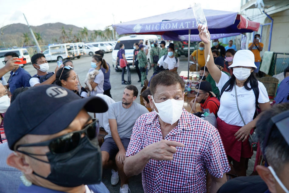 President Rodrigo Duterte tends to the survivors of Typhoon Odette as he visits the affected areas on Siargao Island, Surigao del Norte on December 22, 2021. KING King Rodriguez, Presidential Photo/file