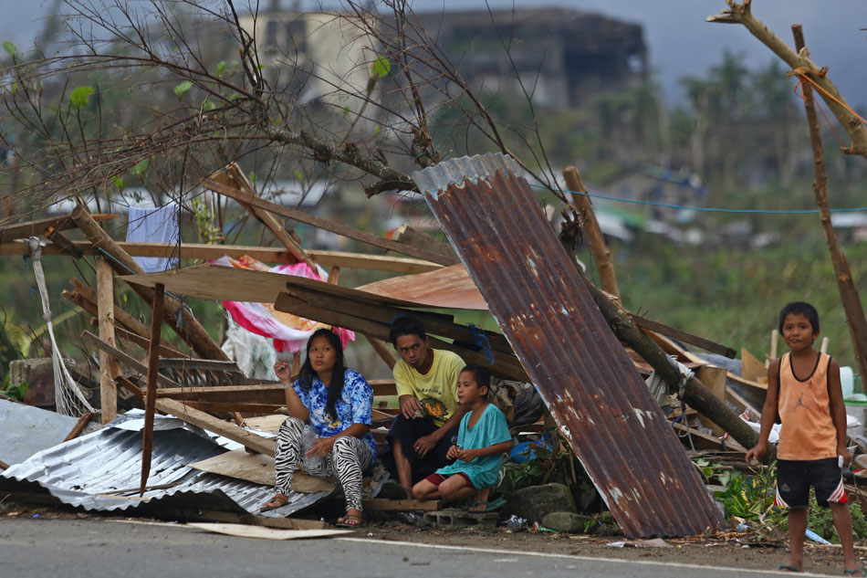  Residents build makeshift shelters following the destruction of their houses due to by typhoon Rai, in Surigao City, Surigao del Norte, Philippines, December 21, 2021. Picture taken December 21, 2021. Jilson Tiu/Greenpeace/Handout via Reuters
