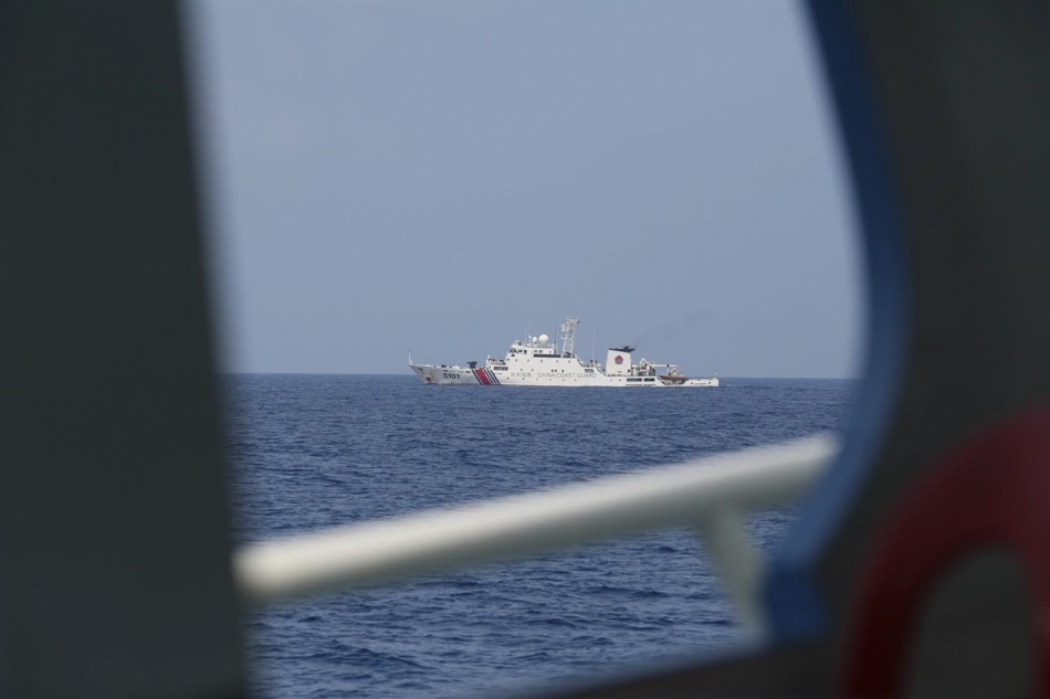 LOOK: Chinese vessels hound Philippine fishing boat | ABS-CBN News