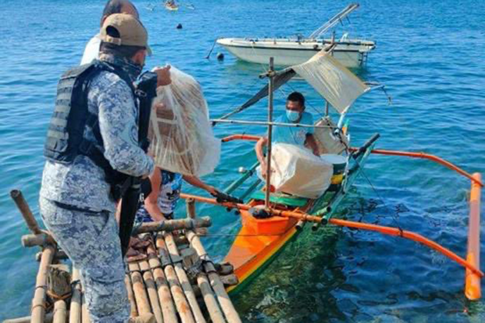 A boat carrying COVID-19 vaccines capsized on its way to Polillo town, Quezon on May 14 2021. Vaccine czar Carlito Galvez and the Department of Health said the jabs were still good to use. Philippine Coast Guard