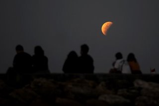 IN PHOTOS: Skygazers watch Super Blood Moon