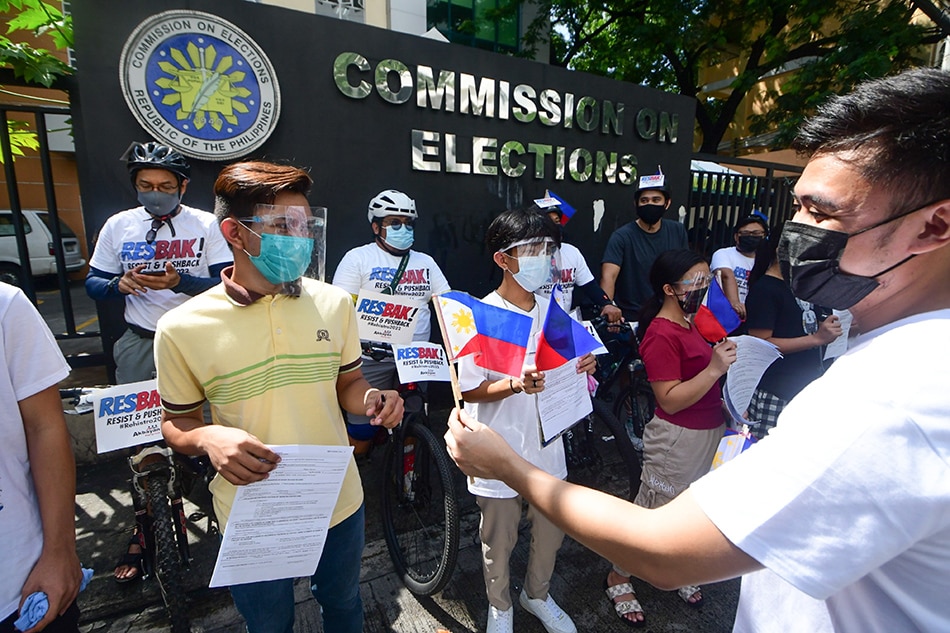 Members of Akbayan Partylist hold a 