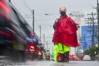 Directing traffic, rain or shine