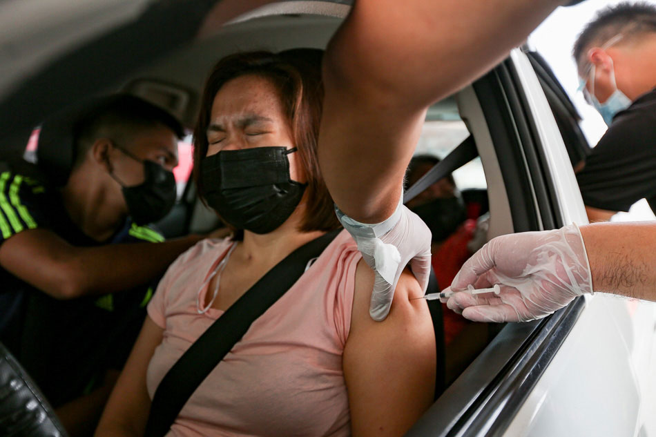 Drive-thru jabs at COVID-19 vaccine site in Manila