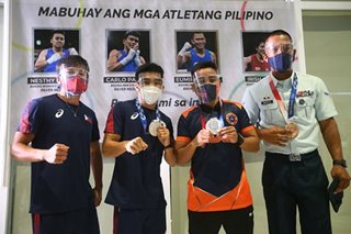 LOOK: Pinoy boxers arrive home after triumphant Tokyo campaign