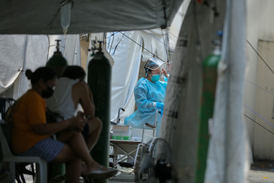 A health worker attends to patients at the Sta. Ana Hospital in Manila on August 13, 2021. Jonathan Cellona, ABS-CBN News