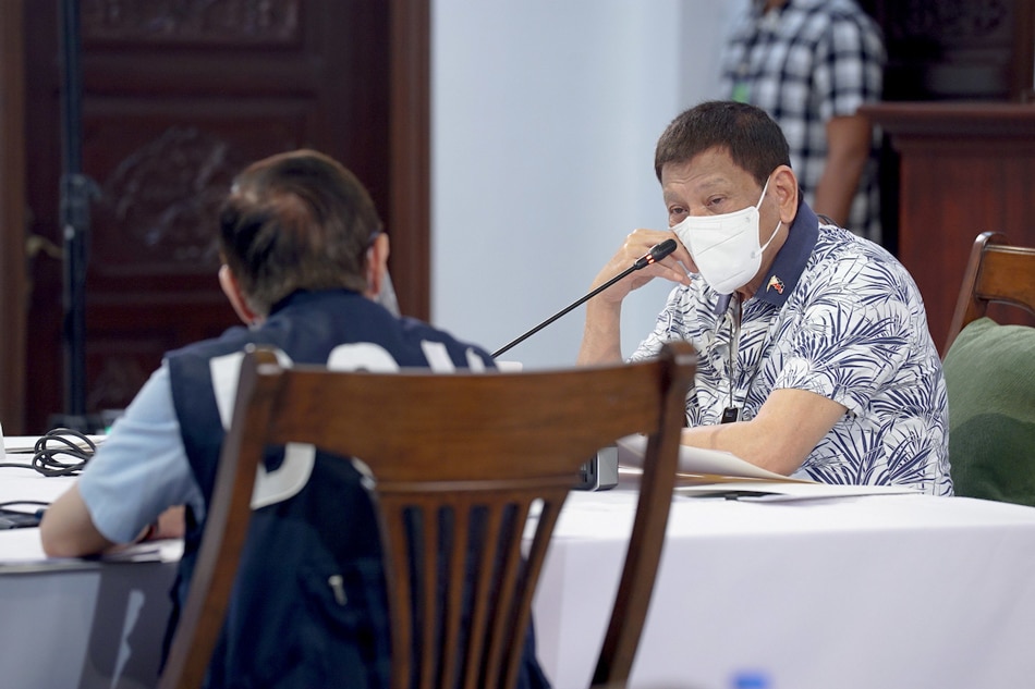 President Rodrigo Duterte confers with Health Secretary Francisco Duque III during a meeting at the Presidential Guest House in Panacan, Davao City on Aug. 10, 2020. Arman Baylon, Presidential Photo