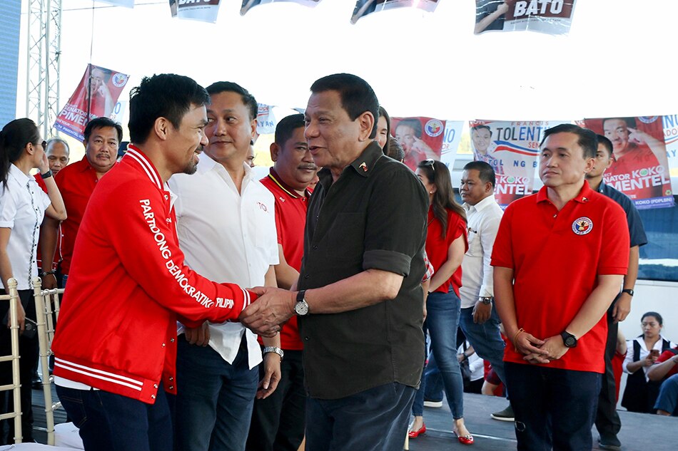 President Rodrigo Duterte greets Sen. Manny Pacquiao at the proclamation and kick-off rally of the Partido Demokratiko Pilipino-Lakas ng Bayan (PDP-Laban) held in the City of San Jose Del Monte, Bulacan, Feb. 14, 2019.