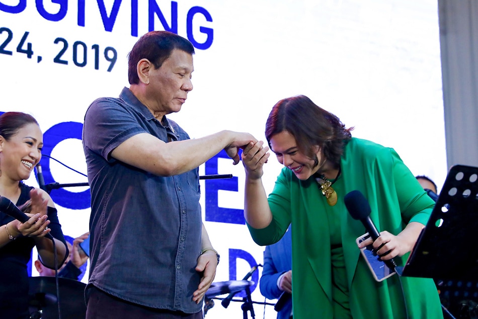 President Rodrigo Duterte extends his hand to his daughter, Davao City Mayor Sara Duterte-Carpio, who showed a gesture of respect during the Hugpong ng Pagbabago (HNP) Thanksgiving Night at the Peninsula Manila in Makati City on June 24, 2019. Richard Madelo, Presidential Photo/File 