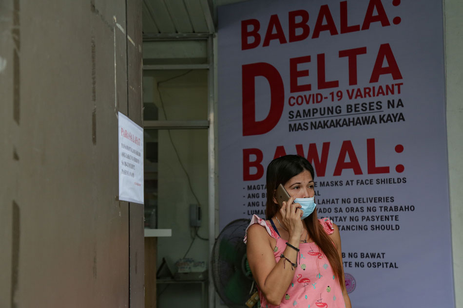  People wait outside the Pasay City General Hospital on August 21, 2021. The hospital temporarily closed its Obstetrics and Gynecology (OB-GYN) services until August 26 to address the significant number of COVID-19 cases among their medical officers. George Calvelo, ABS-CBN News
