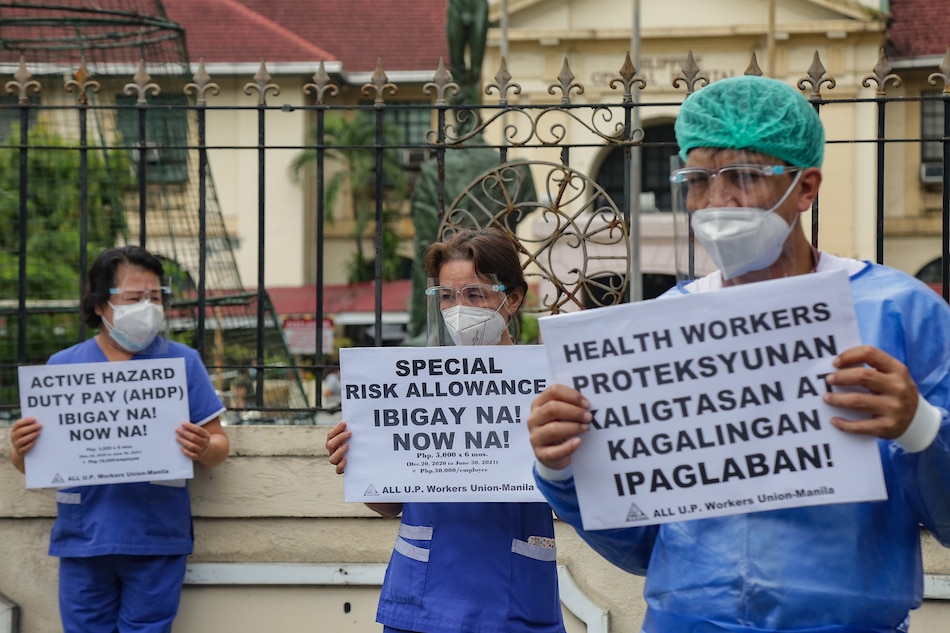 Health workers from the Philippine General Hospital (PGH) led by the All U.P. Workers Union-Manila stage a noise barrage protest in front of their hospital in Manila on August 26, 2021. George Calvelo, ABS-CBN News