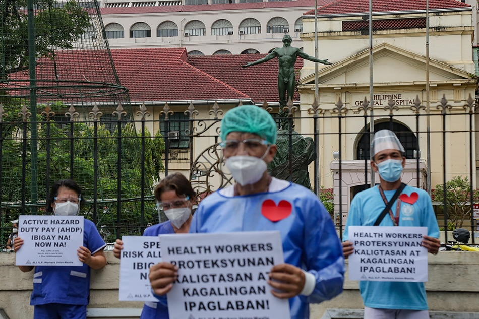 Health workers from the Philippine General Hospital (PGH) led by the All U.P. Workers Union-Manila stage a noise barrage protest in front of their hospital in Manila on August 26, 2021. The group decried the non-payment of COVID-19 benefits and demanded the health department to release their special risk allowance (SRA), active hazard duty pay (AHDP), and their meals, accommodation and transportation allowance (MAT), amounting to a total of P291.6 million, according to the group. George Calvelo, ABS-CBN News