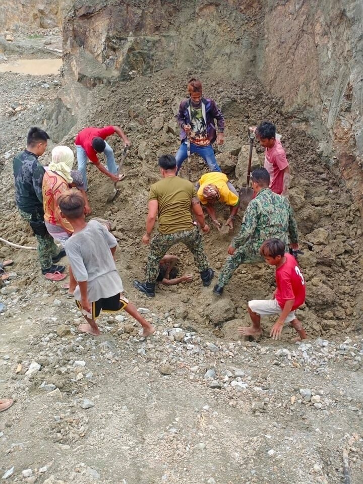 Police officers rescue a family buried alive in a quarry in Getafe town, Bohol. Courtesy of Getafe PNP