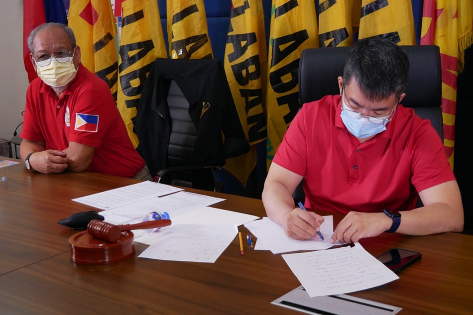 Sen. Koko Pimentel signs a document during a meeting with PDP-Laban party mates on Aug. 29, 2021, during which he was elected as chairman, according to their faction in the party. Courtesy of PDP Laban