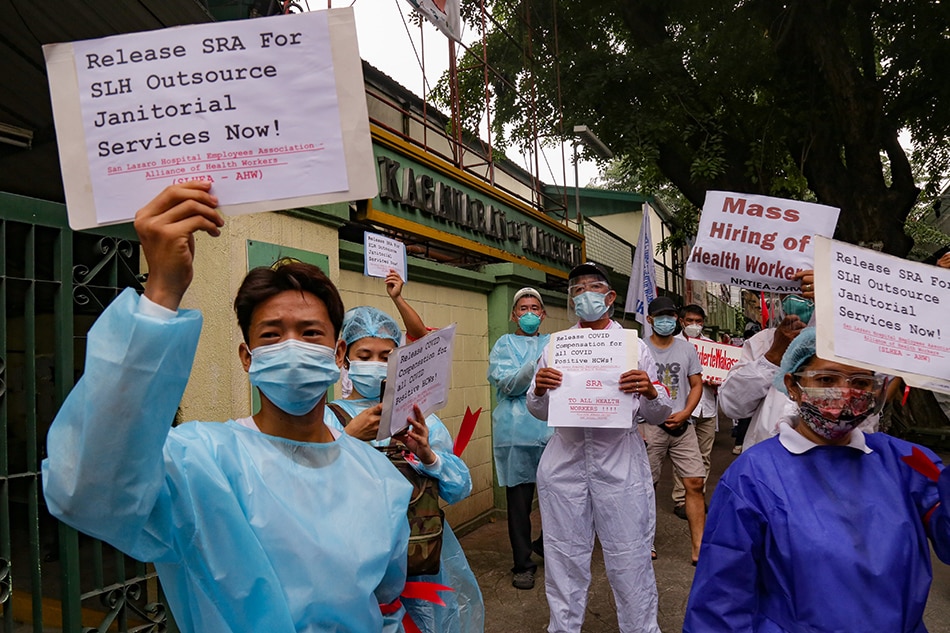 Health workers protest long delays in the release of their special risk allowance at the Department of Health office in Manila, September 1, 2021. 