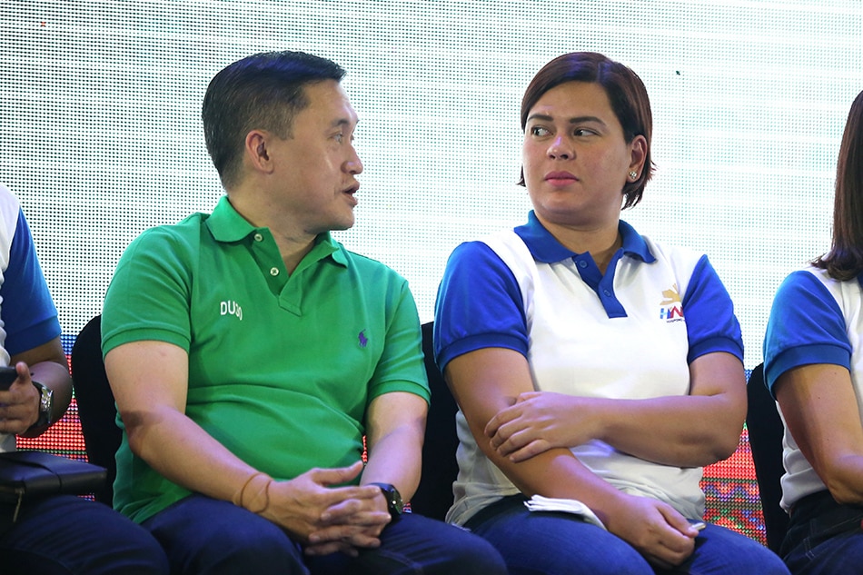 Then Sec. Bong Go of the Office of the Special Assistant to the President with Davao City Mayor Sara Duterte as he is sworn in as new member of the Hugpong ng Pagbabago (HNP) during the oath-taking ceremony at the SMX Convention Center in Davao City on August 17, 2018. 