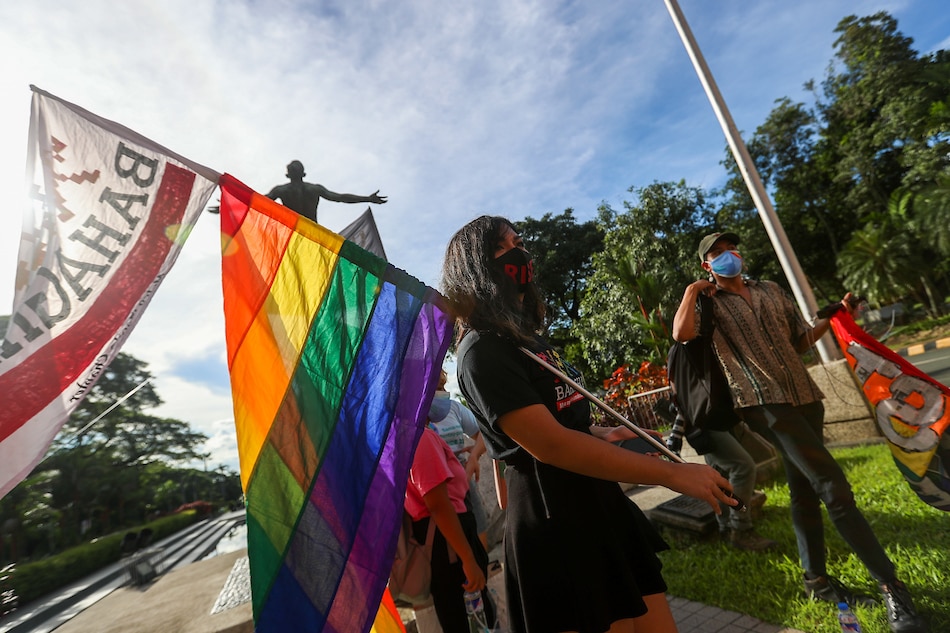 Members of the LGBT community gather inside UP Diliman and carry rainbow flags for the UP Pride March on October 30, 2020, Jonathan Cellona, ABS-CBN News.