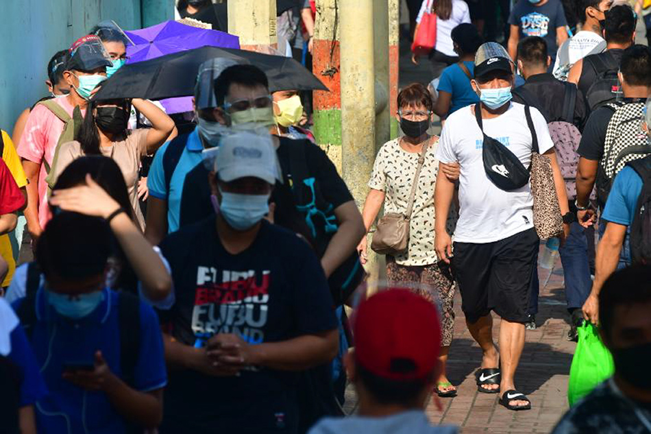 Commuters queue to ride the EDSA bus carousel at the Monumento station in Caloocan City on September 2, 2021, amid the modified enhanced community quarantine. The country breached the two million mark in total number of COVID-19 cases on September 1, after 14,216 more infections were logged according to the Department of Health. Mark Demayo, ABS-CBN News