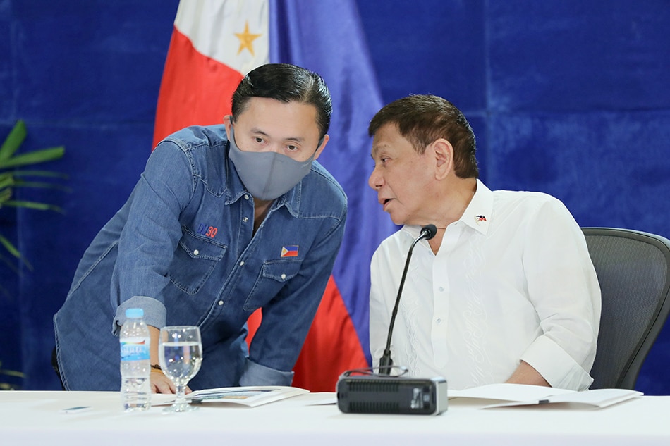 President Rodrigo Duterte discusses matters with Senator Bong Go during the meeting with the Inter-Agency Task Force on the Emerging Infectious Diseases (IATF-EID) core members at the Arcadia Active Lifestyle Center in Matina, Davao City on Sept. 2, 2021. 