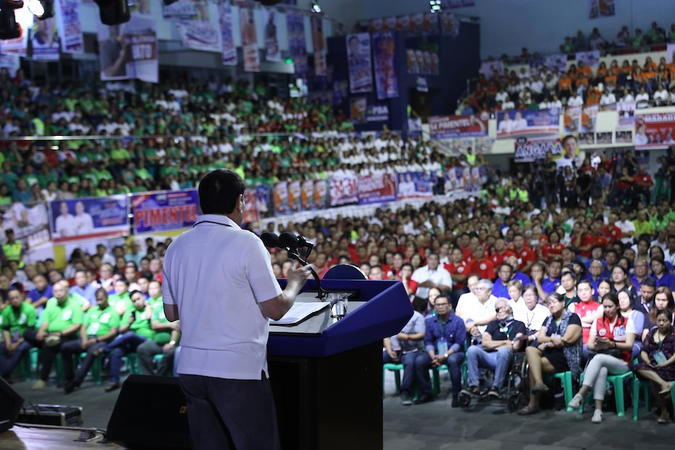 Thousands of supporters listen as President Rodrigo Duterte delivers his speech during the Partido Demokratiko Pilipino-Lakas ng Bayan (PDP-Laban) campaign rally at the University of Science and Technology of Southern Philippines in Cagayan de Oro City on March 24, 2019. Robinson Niñal, Presidential Photo