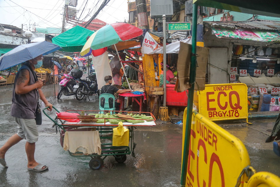 Residents pass through a community quarantine gate set up in Brgy. 178 in Pasay City on September 07, 2021. Neighborhood watchmen man the gate in shifts as the city waits for granular lockdown rules from Covid-19 response authorities. Jonathan Cellona, ABS-CBN News