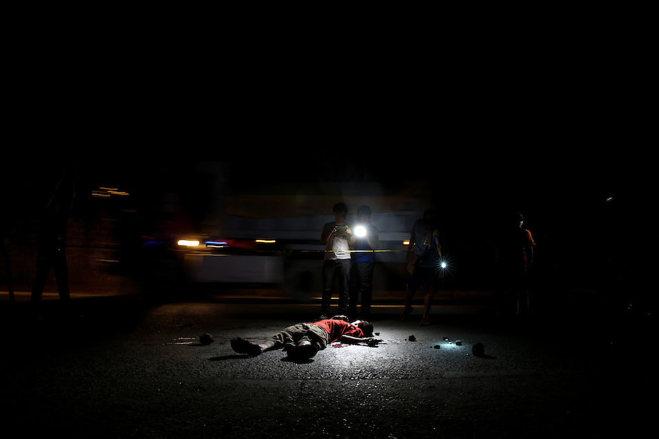  A man lies dead after he was gunned down along Payatas Road in Quezon City on February 10, 2017 in an apparent vigilante killing related to the drug war. Fernando G. Sepe Jr., ABS-CBN News/File