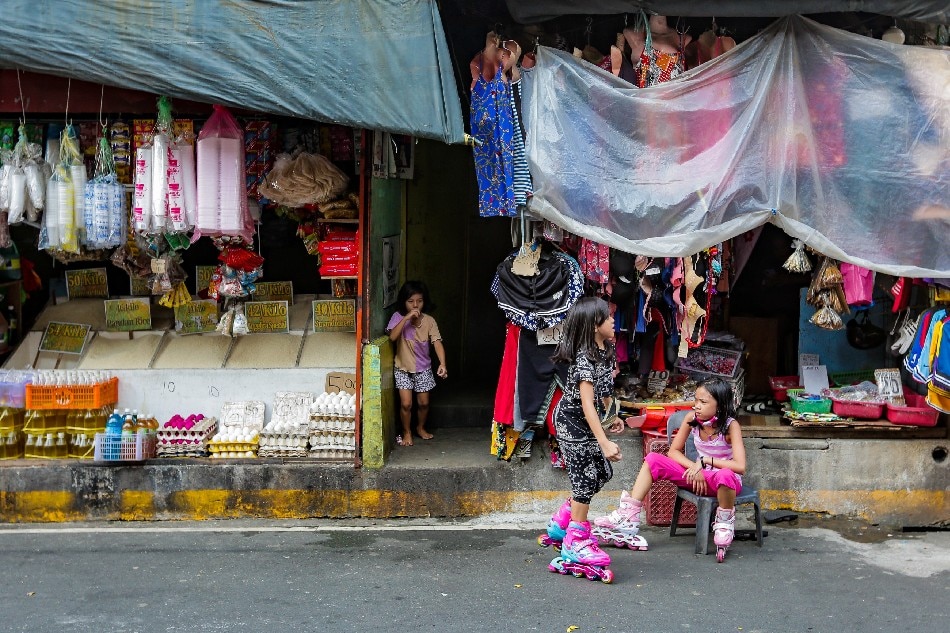 Children play at the Paco Public Market in Manila on September 14, 2021. George Calvelo, ABS-CBN News/File