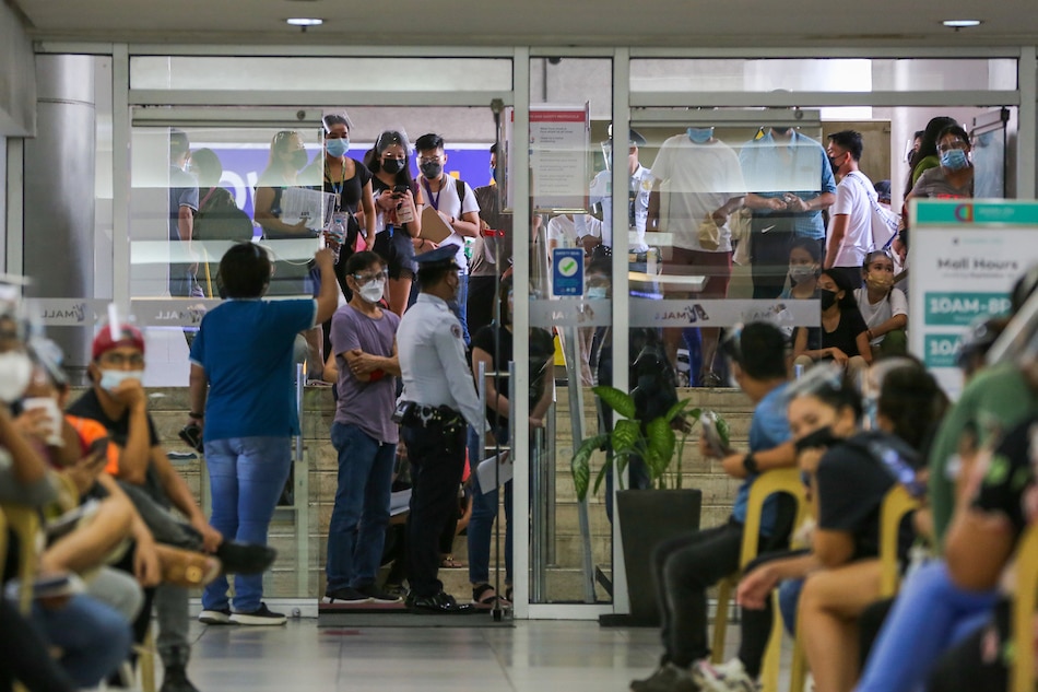  Residents line up as the Commission on Election in partnership with the Araneta group launches its one-day voter registration for residents of Quezon City District 3 at the Ali Mall Activity Area in Cubao, Quezon City on September 27, 2021. Jonathan Cellona, ABS-CBN News