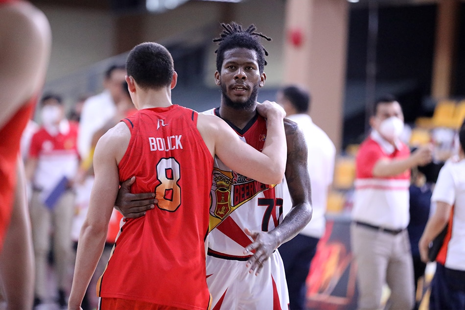 San Miguel's CJ Perez embraces NorthPort guard Robert Bolick after the Beermen's 100-95 triumph in their PBA Philippine Cup quarterfinal game.