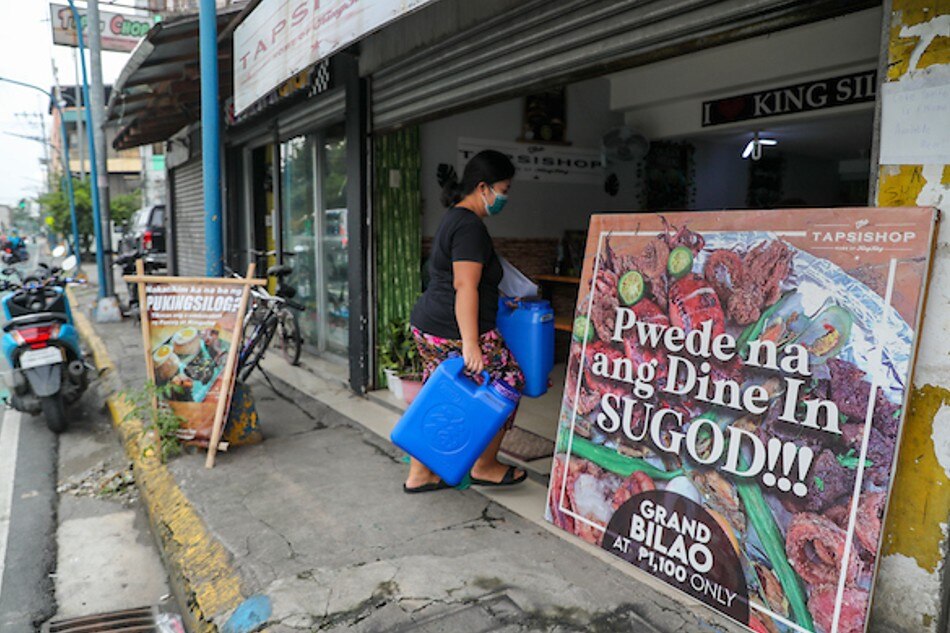 Small restaurants prepare to accept limited dine-in customers in Manila on September 30, 2021. Jonathan Cellona, ABS-CBN News