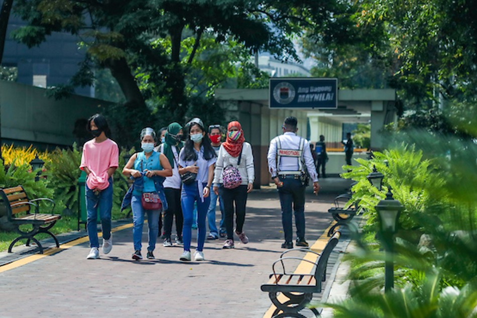 People walk along a park near Plaza Lawton in Manila on Sept. 29, 2021. Jonathan Cellona, ABS-CBN News/File