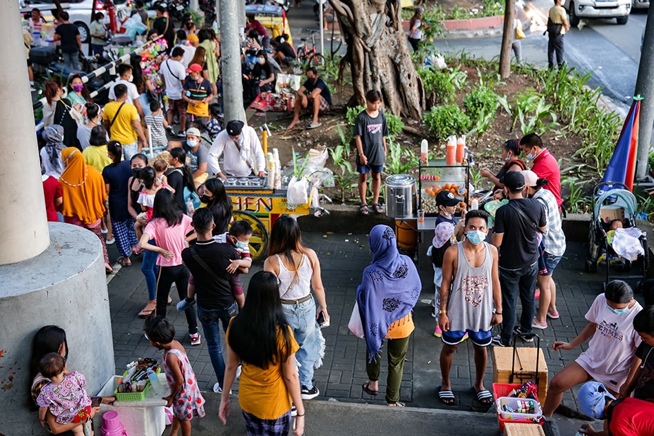 The presence of vendors drastically increase in the area as people flock to the Manila Baywalk dolomite beach to watch the sunset on October 21, 2021. George Calvelo, ABS-CBN News/File