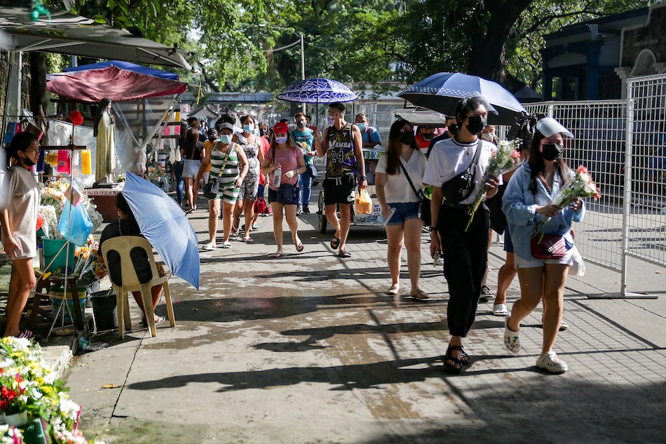 People flock to the Manila North Cemetery to visit their departed loved ones on October 27, 2021. According to officials, over 8,000 people have already visited the cemetery 2 days ahead of its closure on October 29. George Calvelo, ABS-CBN News