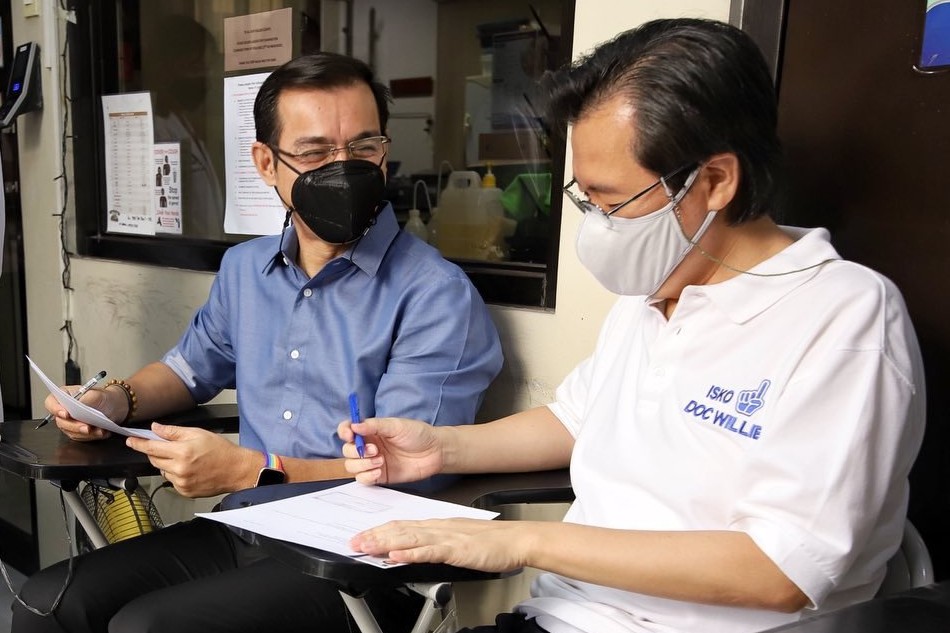 Aksyon Demokratiko presidential aspirant Isko Moreno Domagoso and vice presidential bet Willie Ong submit urine samples as they undergo voluntary drug testing at the Philippine Drug Enforcement Agency office in Quezon City. Handout