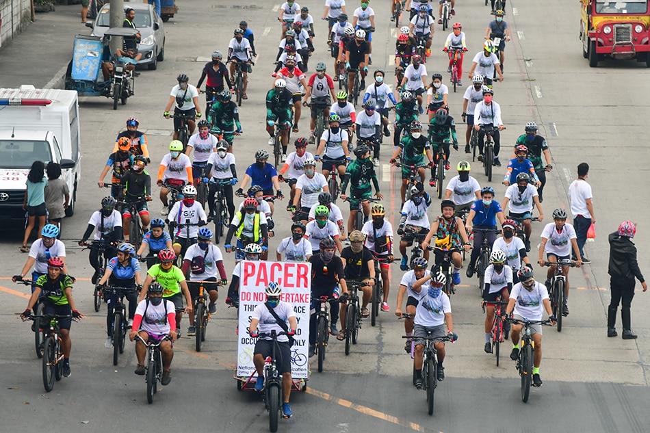 Bikers ride out from Quezon City to Navotas led by the National Bicycle Organization with the Department of Environment and Natural Resources on National Bicycle Day, November 28, 2021. Bicycle usage and demand for better cycling infrastructure in the country emerged during the COVID-19 pandemic. Mark Demayo, ABS-CBN News