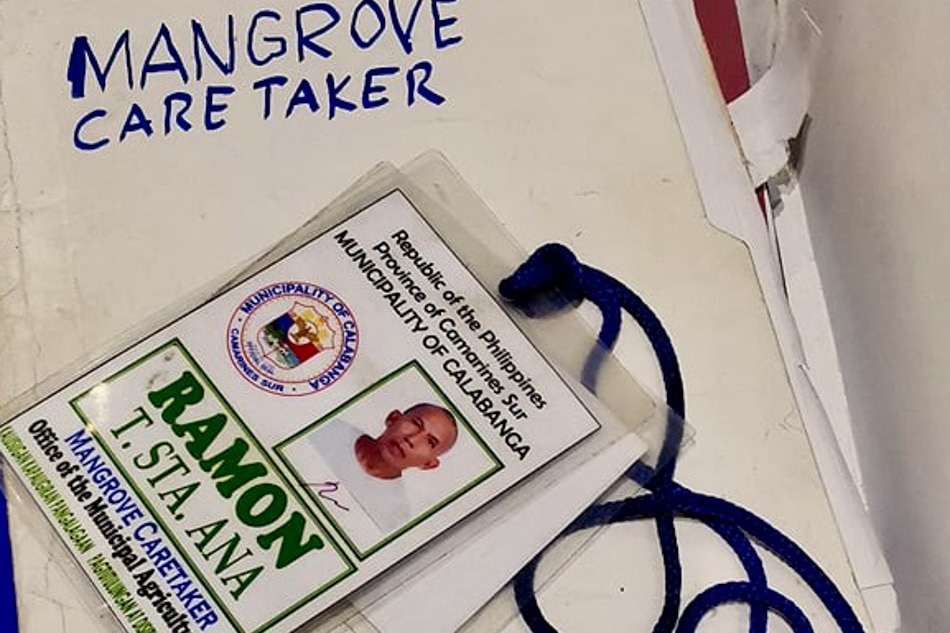 HUMBLE AND PROUD: Mon proudly identifies himself as caretaker of the mangrove forest. He always wears this ID with a smile. Jun Santiago III, CSsR